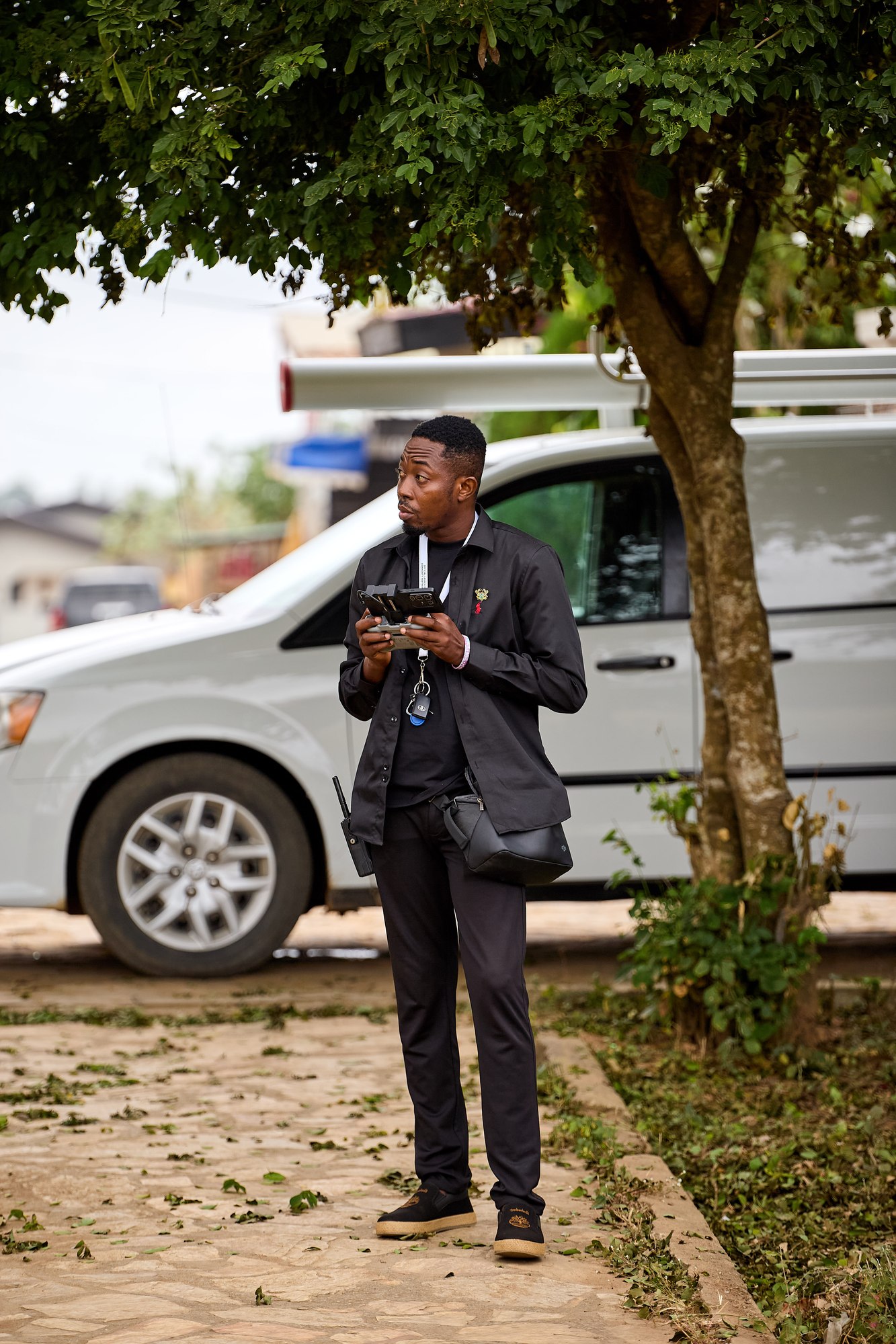 Production crew member holding a field monitor